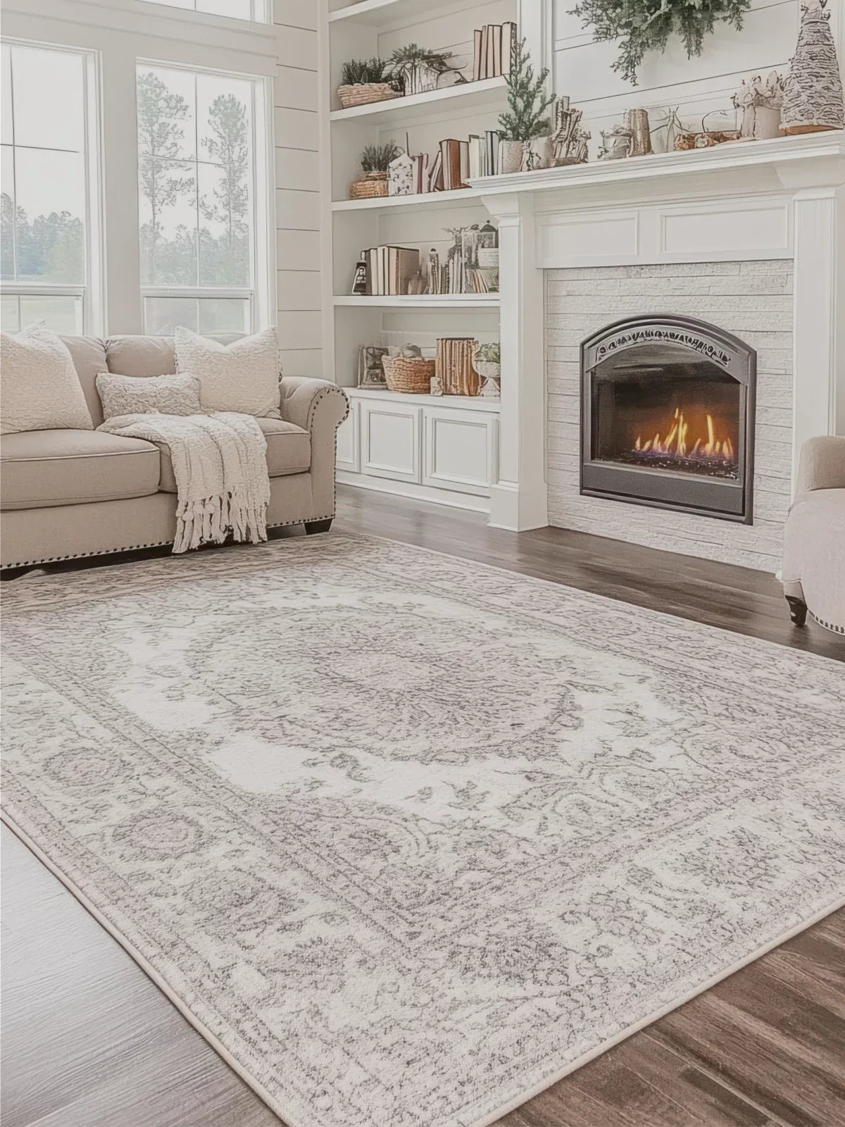 Elegant farmhouse-style living room featuring a 6x9 washable rug with intricate patterns, a cozy beige sofa, and a fireplace for a warm ambiance.