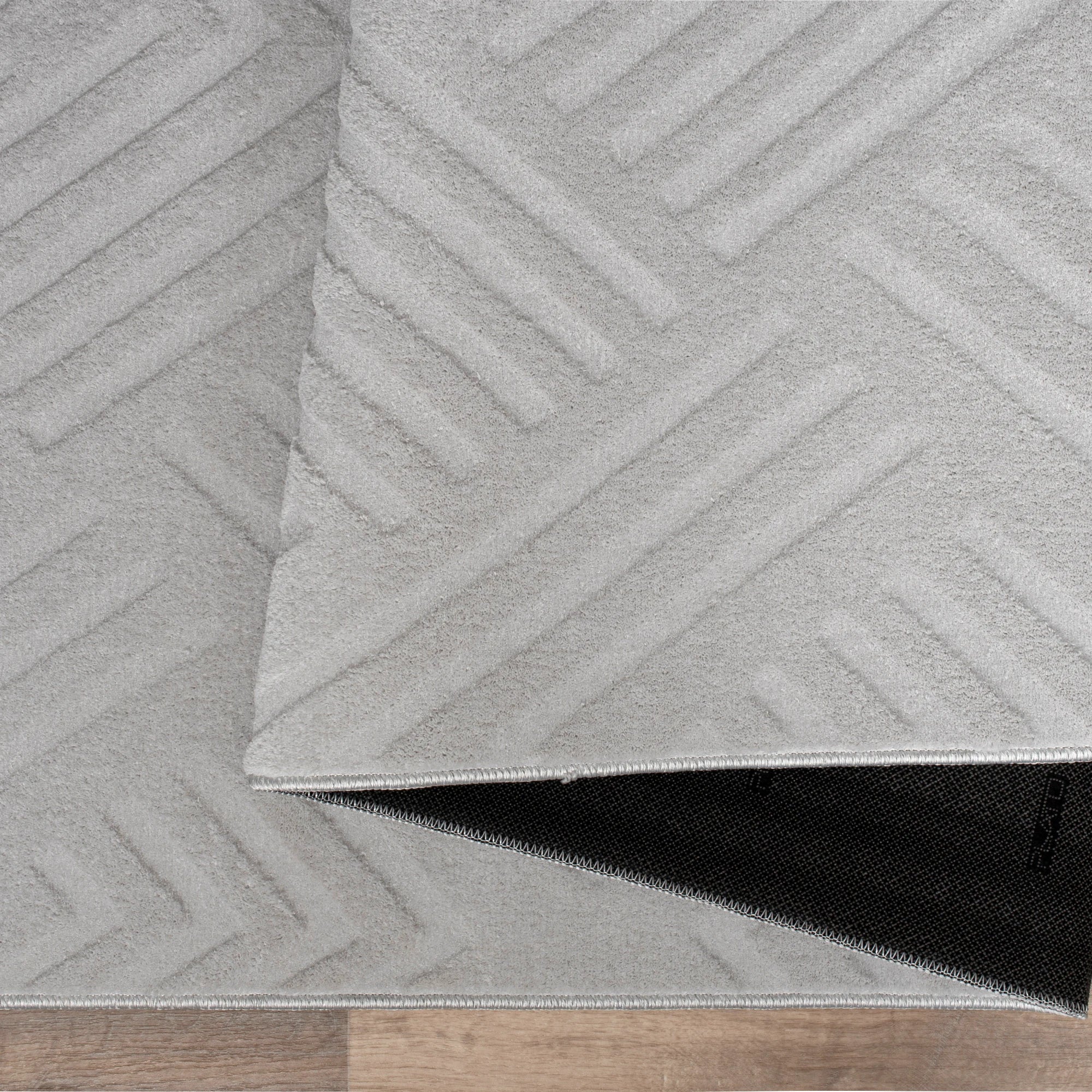 Світло-сірий плюшевий килим із геометричним візерунком лабіринту