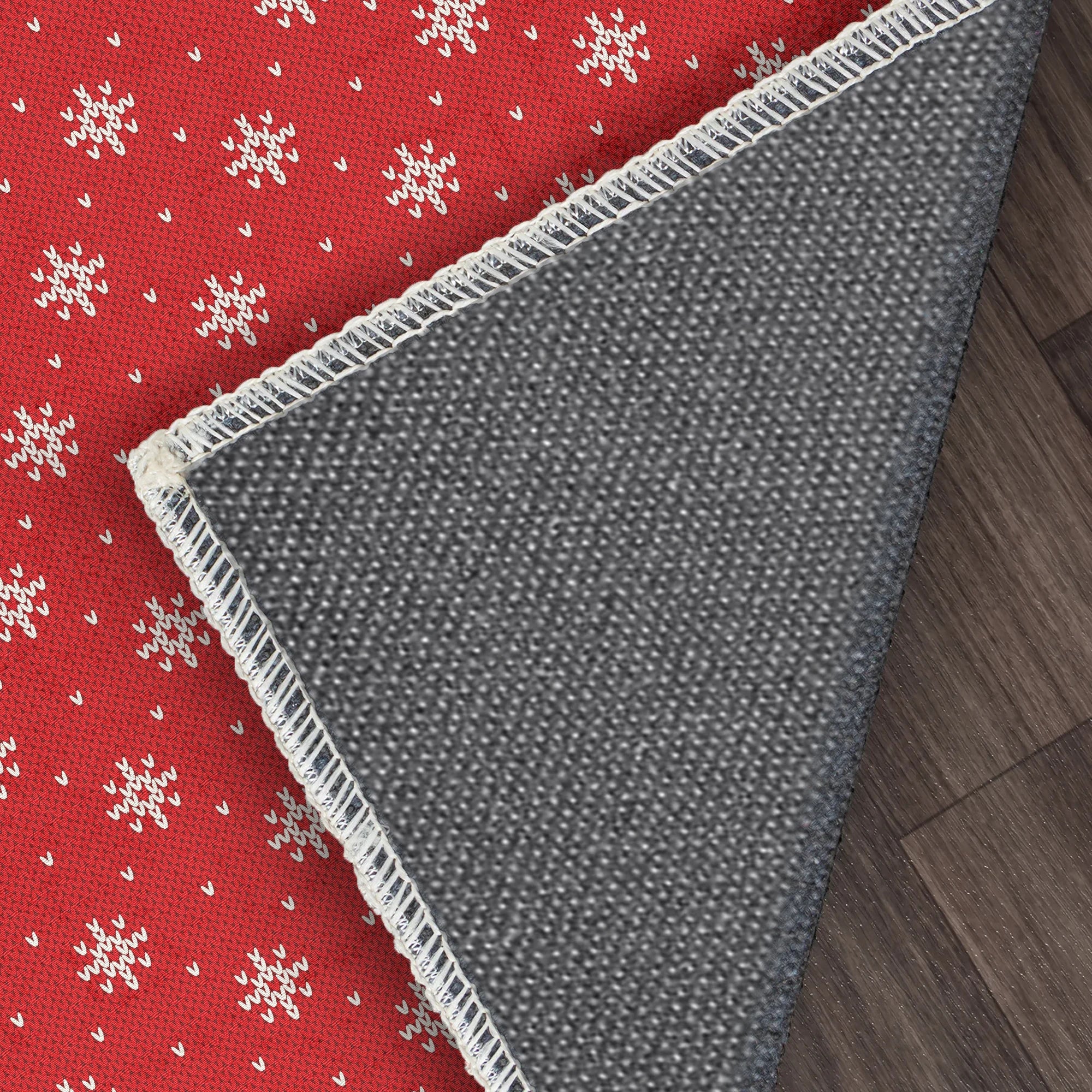 В'язаний килимок зі сніжинками червоного кольору, який можна прати